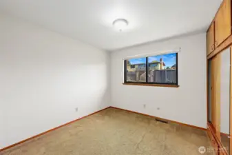 BEDROOM #2  Original hardwoods under carpet  Windows with views of rear yard   Floor to ceiling built in closet with storage cabinets