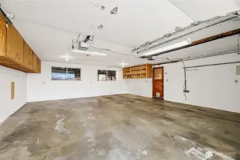 2 CAR GARAGE  Work bench  Separate door openers / Storage cabinets