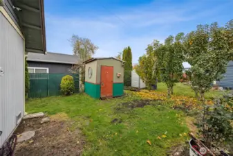 Storage shed included. Comes with fruit trees too!