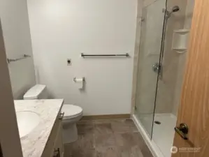 large walk in closet with safety bar