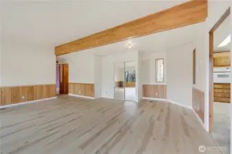 The spacious living room without the staging.