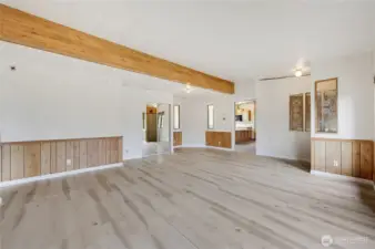 The coat closet has mirrored doors, the door goes to the family room, kitchen and primary suite.