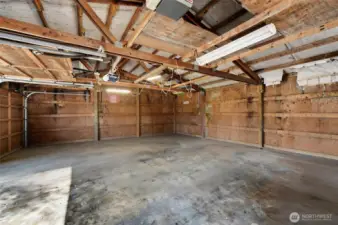 The inside view of the large 815 sq ft garage / shop. The pusses are endless!!