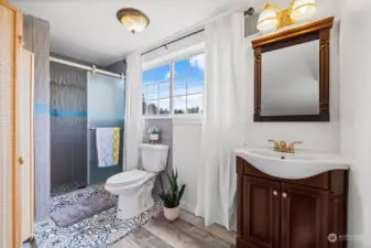 3/4 bath off upper bedroom features custom tile.
