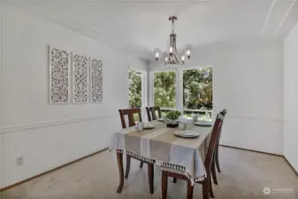 Formal dining room with a view of the backyard.