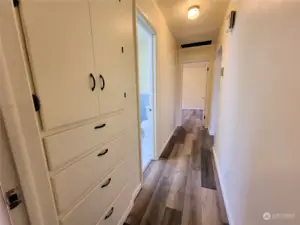 Hallway with lots of built in storage.