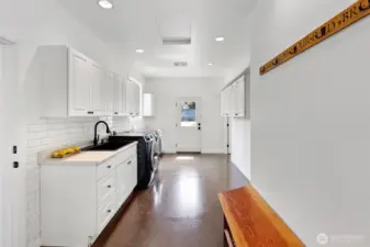 What an amazing laundry/mud room! Separate entrance which works well for access to the junior suite.
