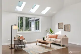 Skylights keep the house extra light and bright. Large living room area.