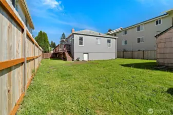 Large, fully fenced backyard with so much space to play, garden, or all your projects.