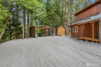 Extra parking area for RV and easy access to wood shed.