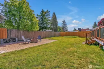 Large backyard with firepit