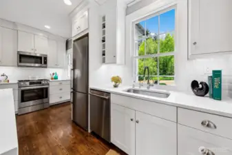 From kitchen to hearth, the home unfolds in effortless dialogue—spaces connected not only by thoughtful design, but by a shared spirit of welcome. Here, modern fixtures meet timeless form, offering a backdrop for both lively gatherings and solitary mornings steeped in quiet.