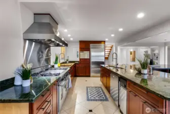 Heated floors, custom Mile appliances, Wet bar, butlers pantry and custom cabinets and storage are just a few highlights from this home.