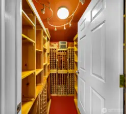 Nice size walk in wine room.