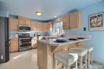 Plenty of storage and a backyard view from the sink.