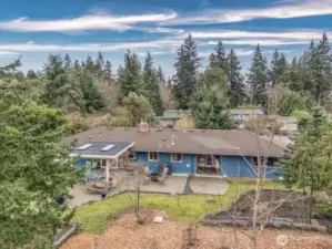 Covered patio with the office entrance to the right with covered area for coffee