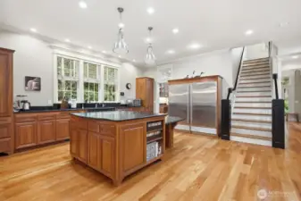 High end professional appliances include a Miele dishwasher, 36-inch side by side Subzero fridge and freezer, farm sink, and huge walk -in pantry with a sink.