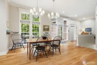 The informal dining space off this area makes for a sunny area for everyday dining and entertaining. A door lead to the deck and stairs to the yard.