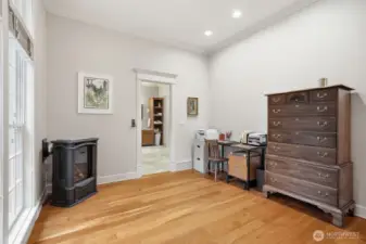 And a sitting area with corner gas fireplace.