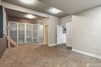 The stand up crawl space is found through a door off this room.