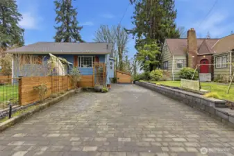 55k invested into driveway  and back patio hardscape with lighting under wall cap