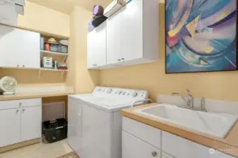 Laundry room with sink and folding table