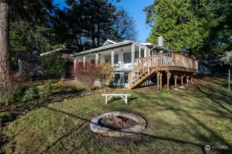 Deck leading to enclosed sunroom plus finished basement below.