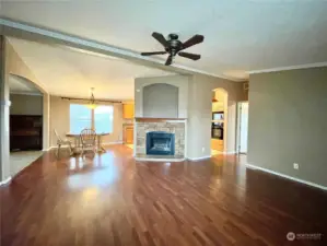 Large great room with cozy stone fireplace.