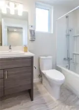 2nd upper floor bathroom of a previous model home in the Avenue plan.  The Courtyard plan also has an upper floor guest bathroom.