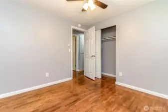 The second bedroom is located across the hallway from the primary bedroom.