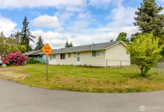 Corner lot, fully fenced in the back.  Separate drive in entrance on the side.