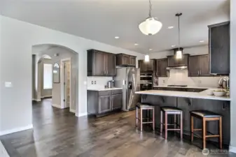 Open floorplan and living downstairs with family room adjacent to the kitchen.