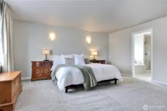 Attached ensuite primary bath and walk in closet.