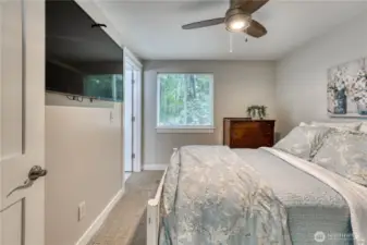 Main level bedroom with an attached 1/2 bath (2 of 3)