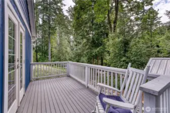 French doors off the living room of the guest cottage lead to this private deck.