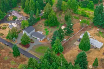 This aerial view shows the convenient circular driveway, with wide gates on both ends.