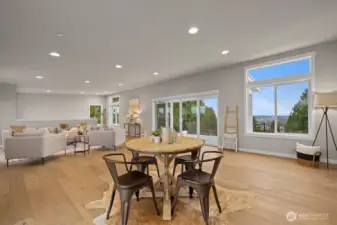 Large bonus room/studio with full kitchen, half bath and access to the partially covered deck on the rooftop level.