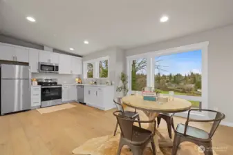 Large bonus room/studio with full kitchen, half bath and access to the partially covered deck on the rooftop level.