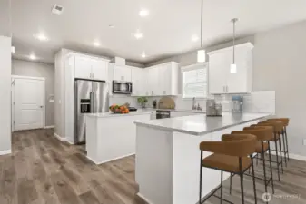 Chef's kitchen with breakfast bar and prep island