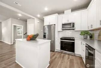 Chef's kitchen with breakfast bar and prep island