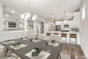 Chef's kitchen with breakfast bar and prep island and dining area