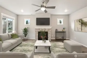 Living room with lots of natural light and fireplace