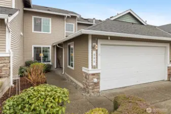 Charming entry to the left of garage.