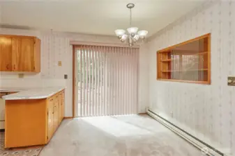 Dining Area Off Kitchen With Slider to Backyard