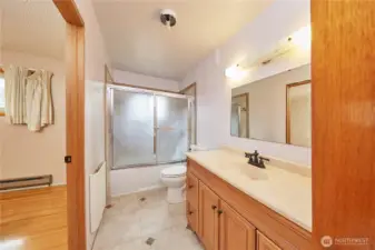 Full Bath Adjoining Primary Bedroom; Tile Floor and Shower and Tub. Tons of Storage!!!