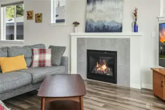 The gas fireplace adds lovely ambiance to the spacious living room.