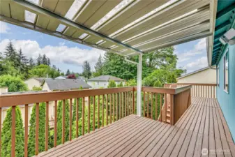 Covered back deck is huge and wonderful for entertaining.