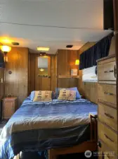 Queen size bed fits comfortably. Lots of storage with built-in dresser and closet.