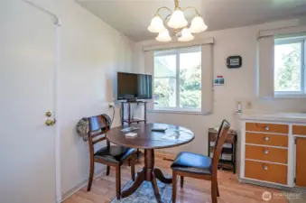The dining area sits just off the kitchen and features direct access to the garage—perfect for everyday convenience.