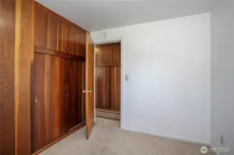 First guest suite offers a built-in closet along with extra storage for added convenience.